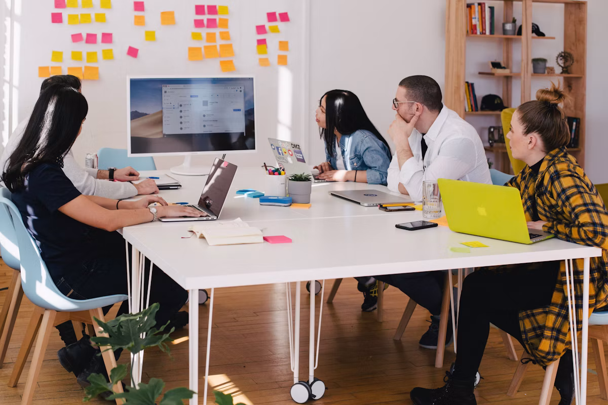 Top AI Calling App - Troika Tech team reviewing client requirements