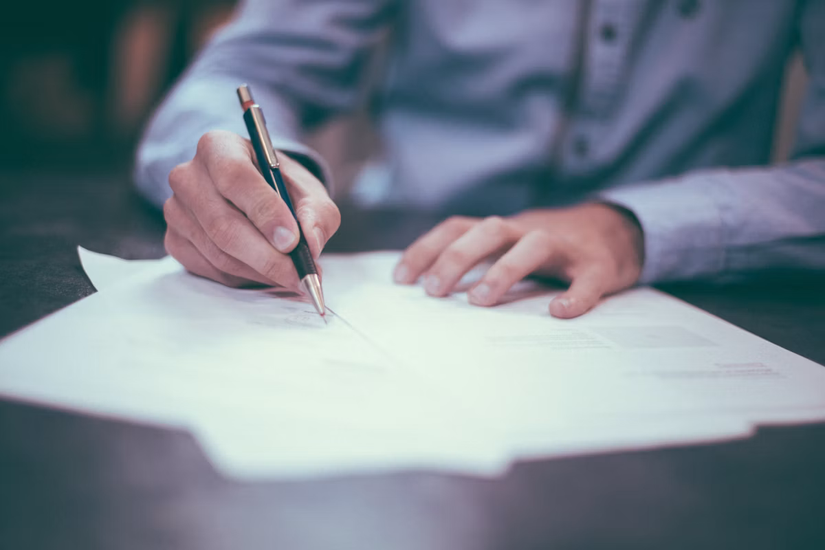 Student signing BCom admission form after AI voice agent counselling
